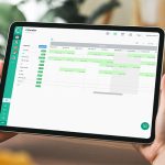 Woman holding tablet which shows the calendar view of Papershift